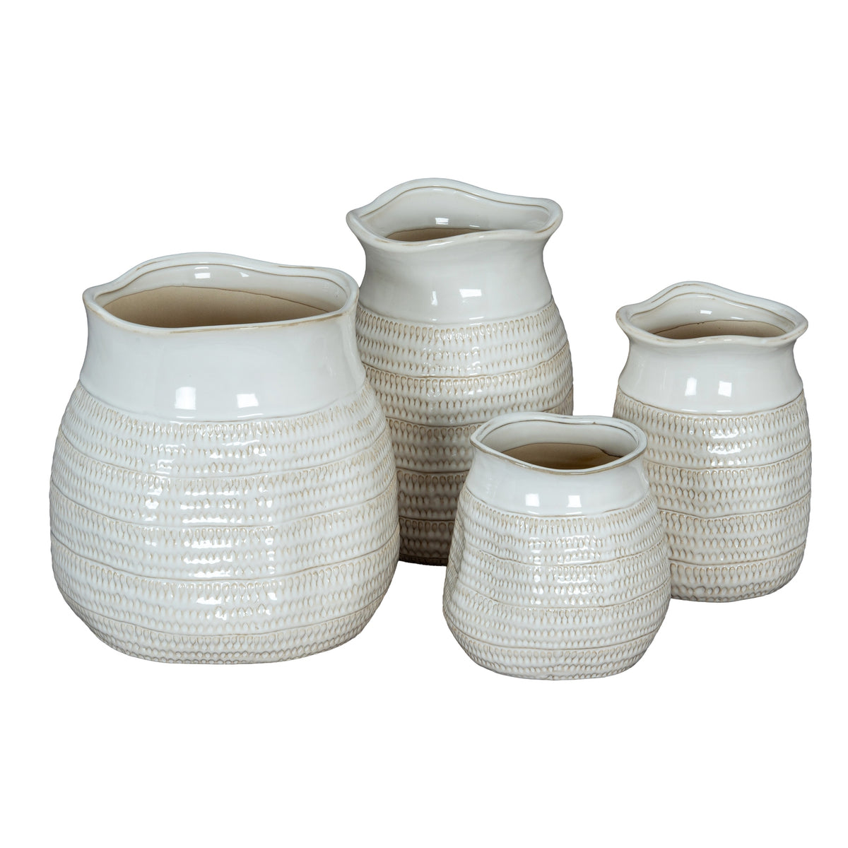 Set of four textured ceramic vases on a white background
