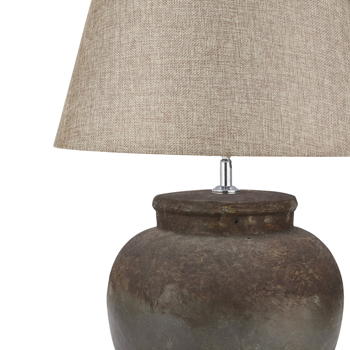 Table lamp with textured brown base and beige fabric shade on a white background