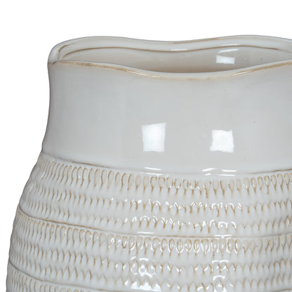 White ceramic vase with textured base on a white background