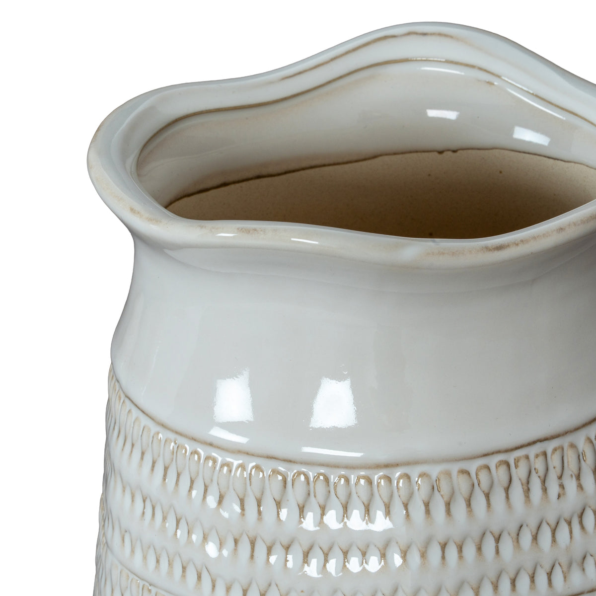 Close-up of a decorative ceramic vase with textured design on a white background
